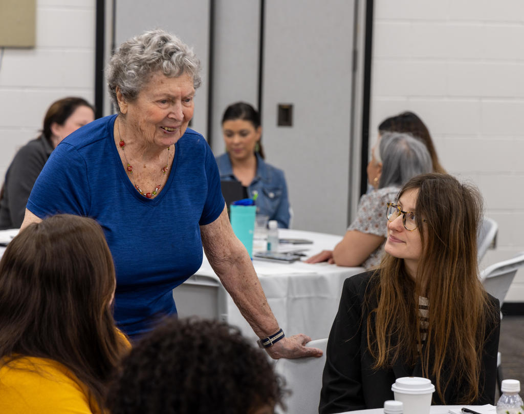 Vivian Jacobson speaks with attendees at the 2024 Women's Empowerment Summit
