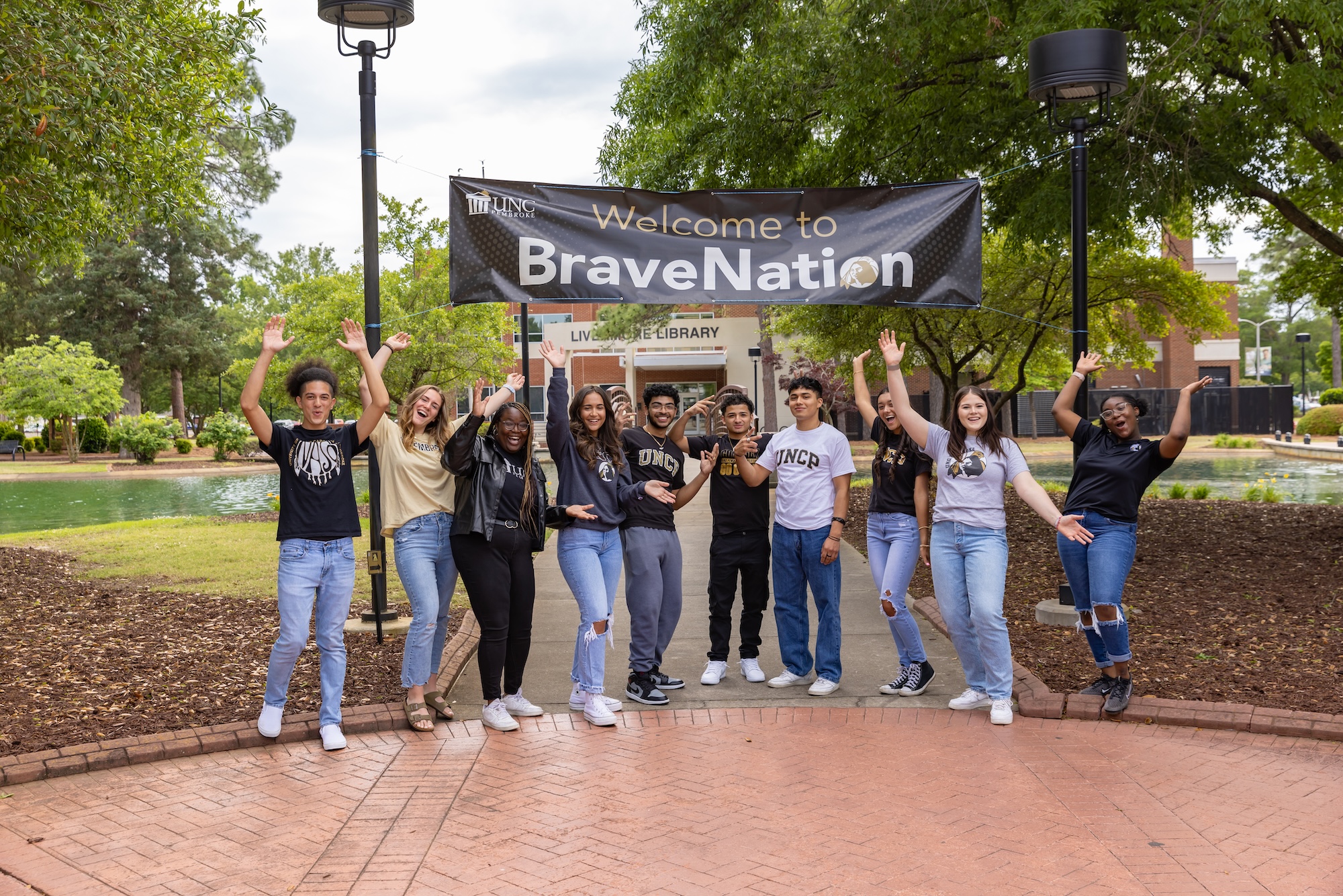 UNCP orientation leaders standing in front of a banner