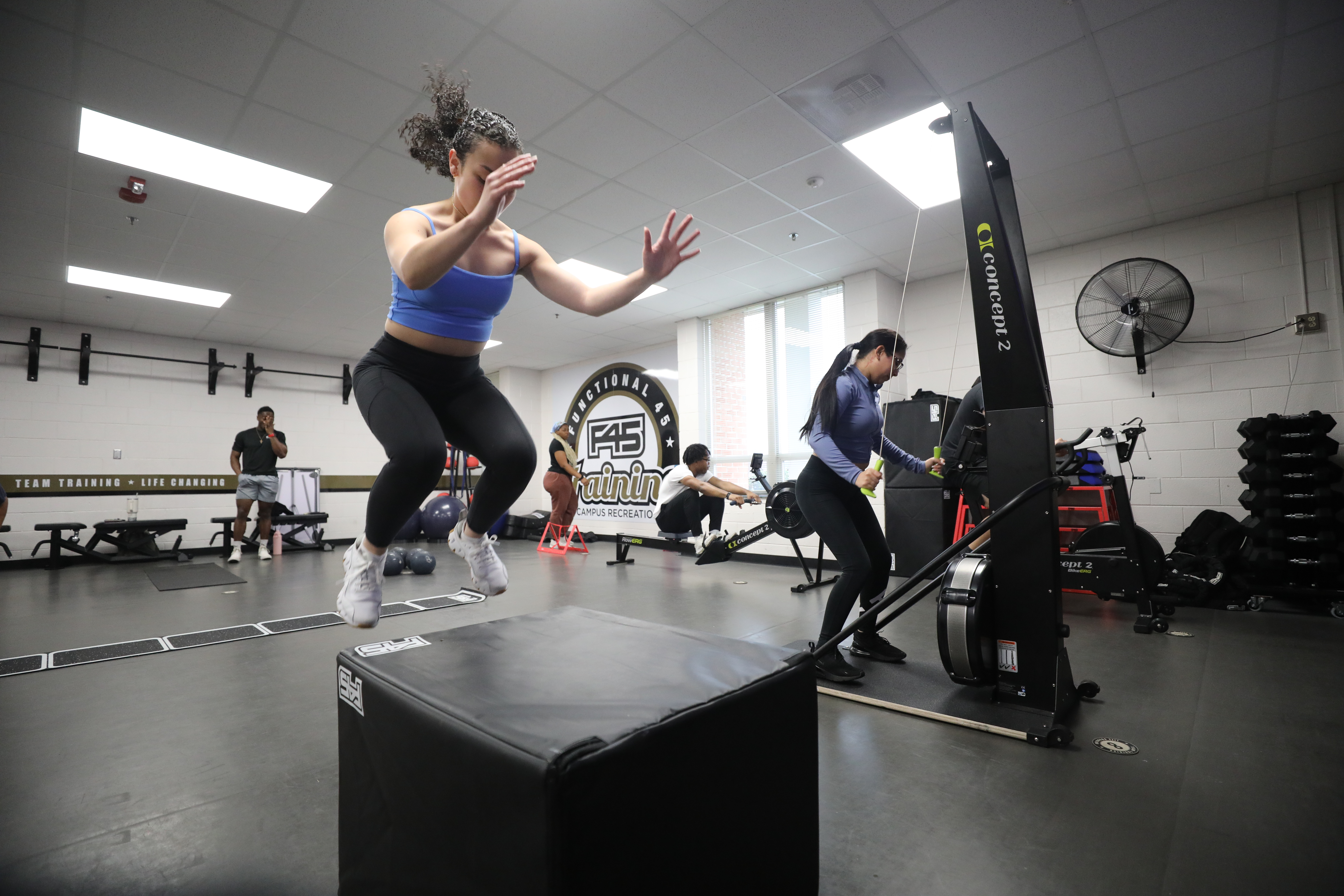 woman jumping on a box