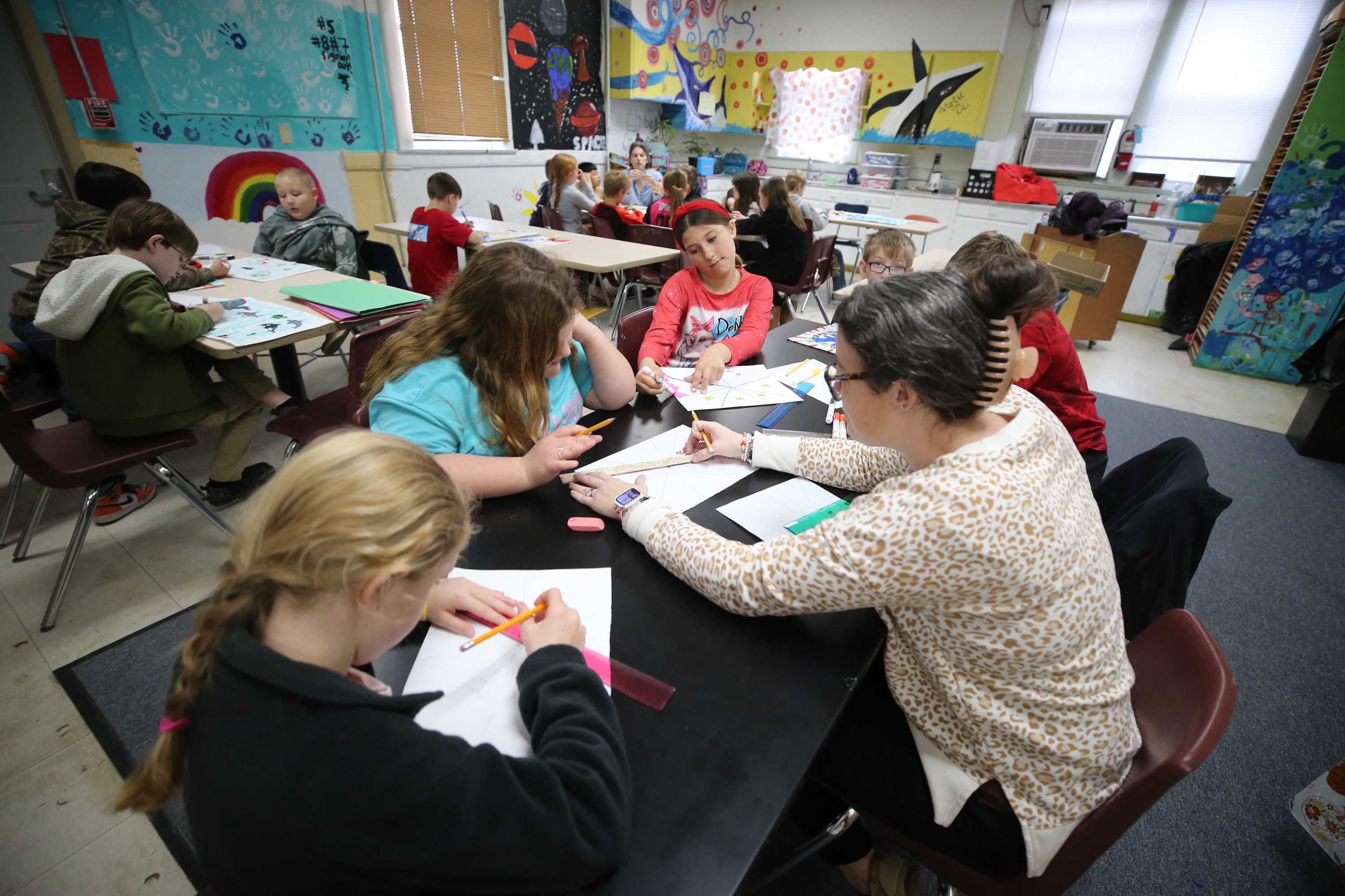 teacher with students in the classroom