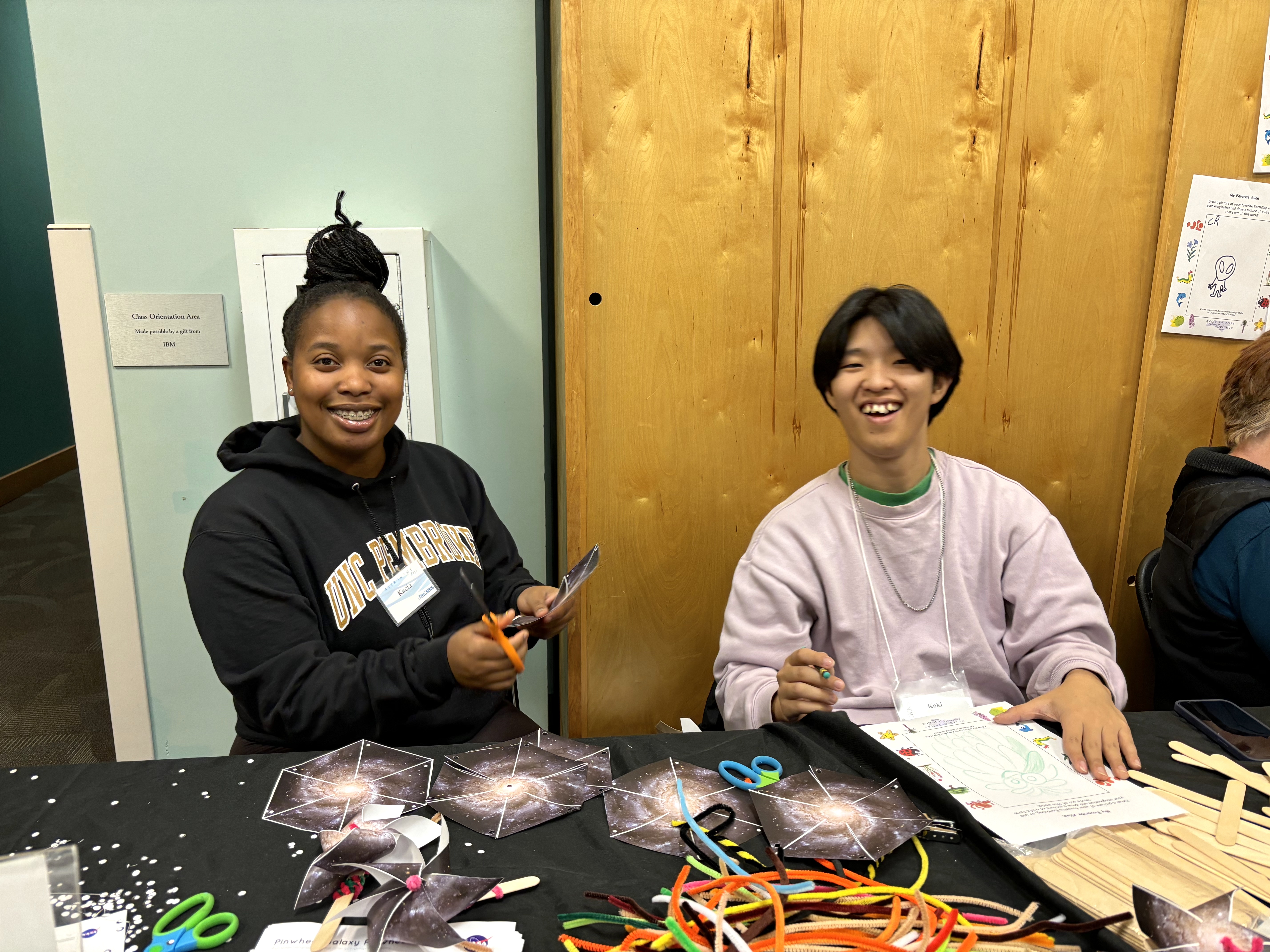 College students staff booth exhibits