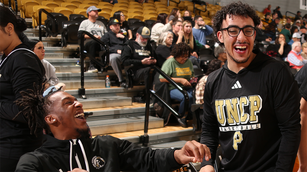 Layth Allan and Nygell Verder share a laugh courtside