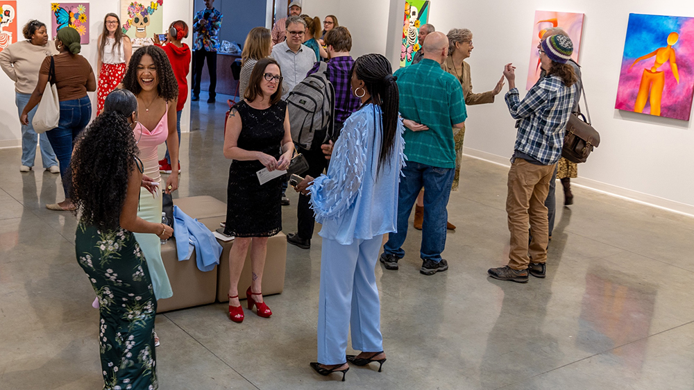 patrons attend art exhibit