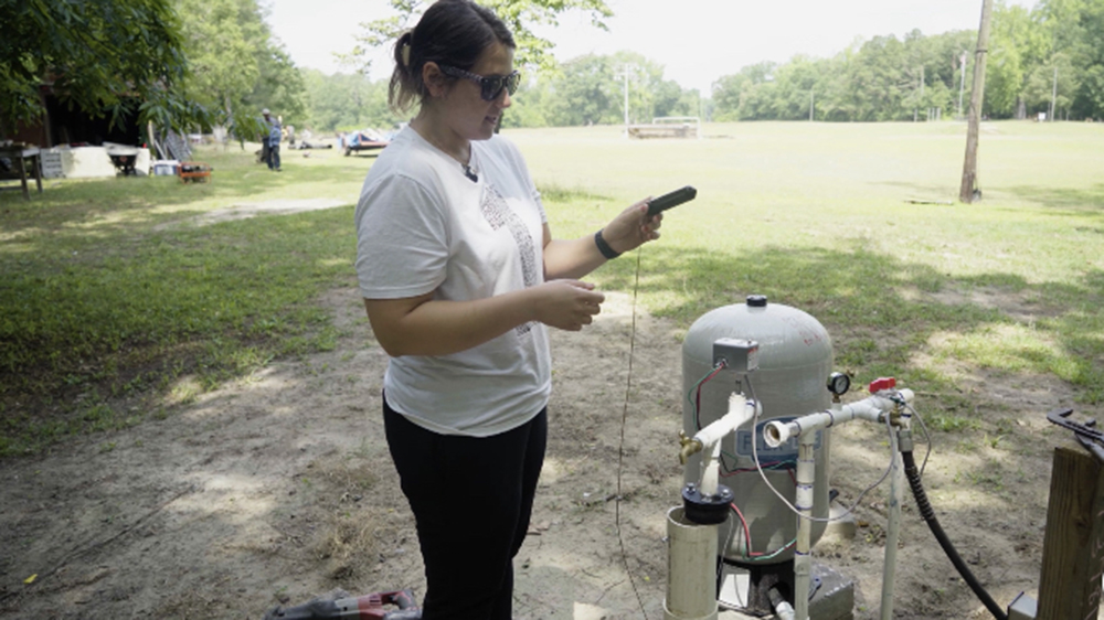 UNCP student Ashley Cashwell Barez running a water test.