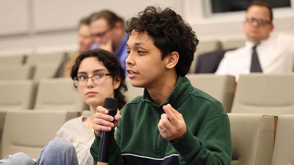 students in the audience join the debate