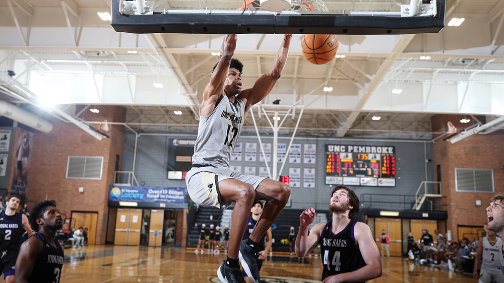 Elijah Cobb brings the crowd to their feet with a dunk against Young Harris