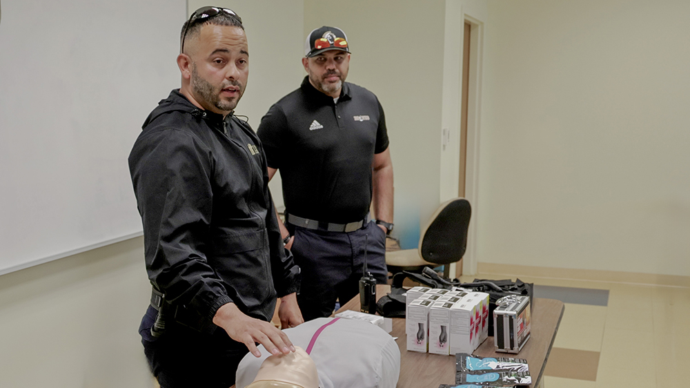 Visiting officers conduct a class in Criminal Justice