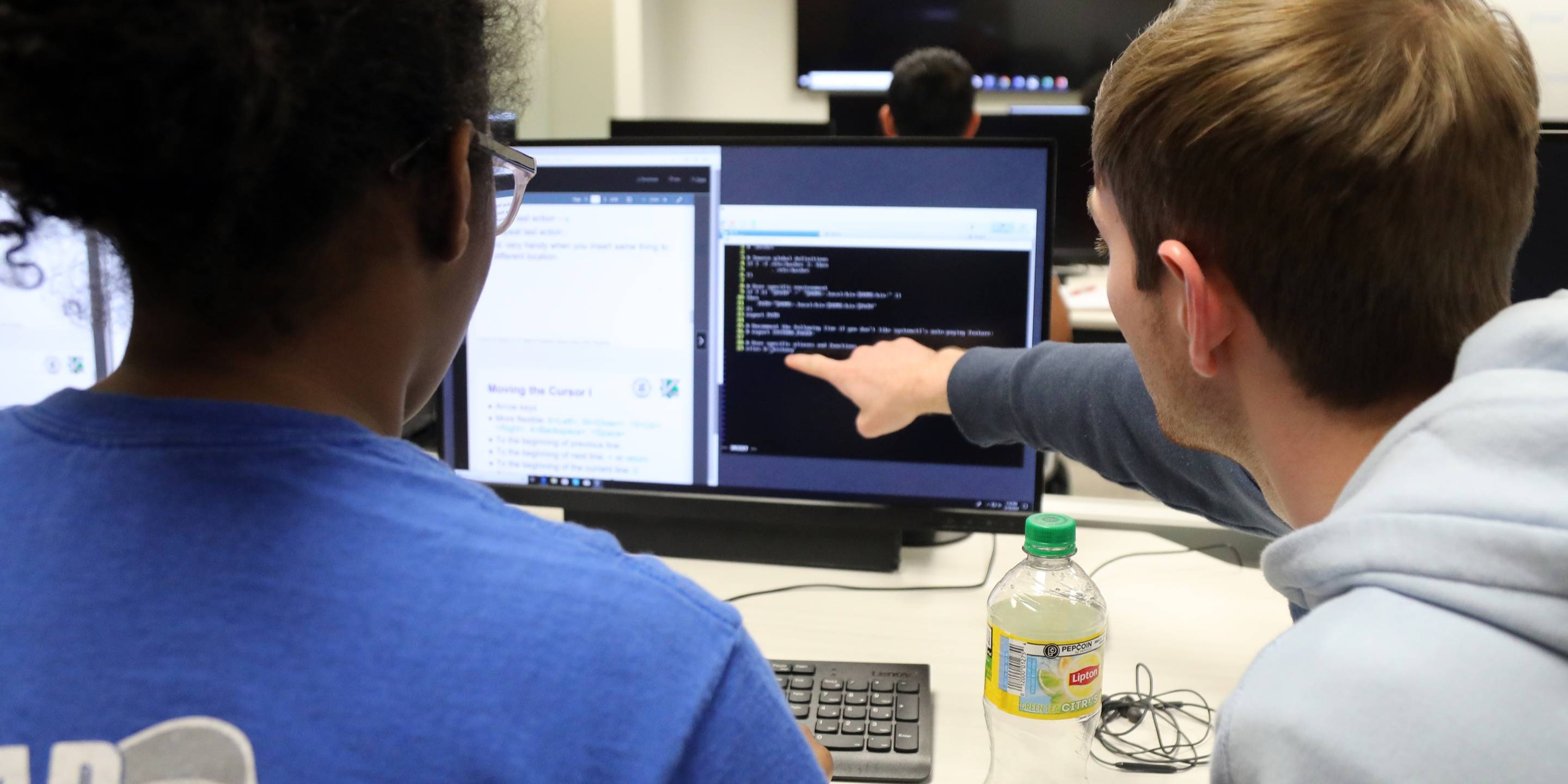 students working at a computer screen