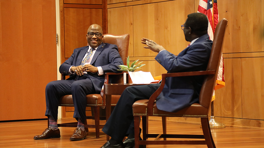 Dr. Cliff Mensah (right) conducts a fireside chat with Brigadier General Allen Jamerson (Ret.) as part of the Distinguished Speaker Series.