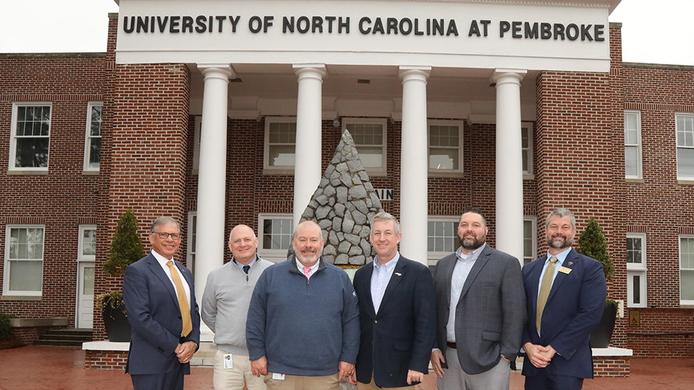Chancellor Robin Gary Cummings, left, Mike Metcalf, Tim Locklair, President Sandy Stewart, DJ Farmer and Jess Boersma