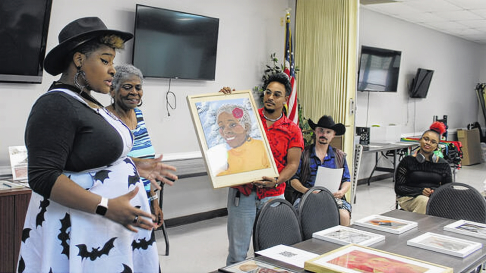 UNCP students show off art to Scotland County seniors