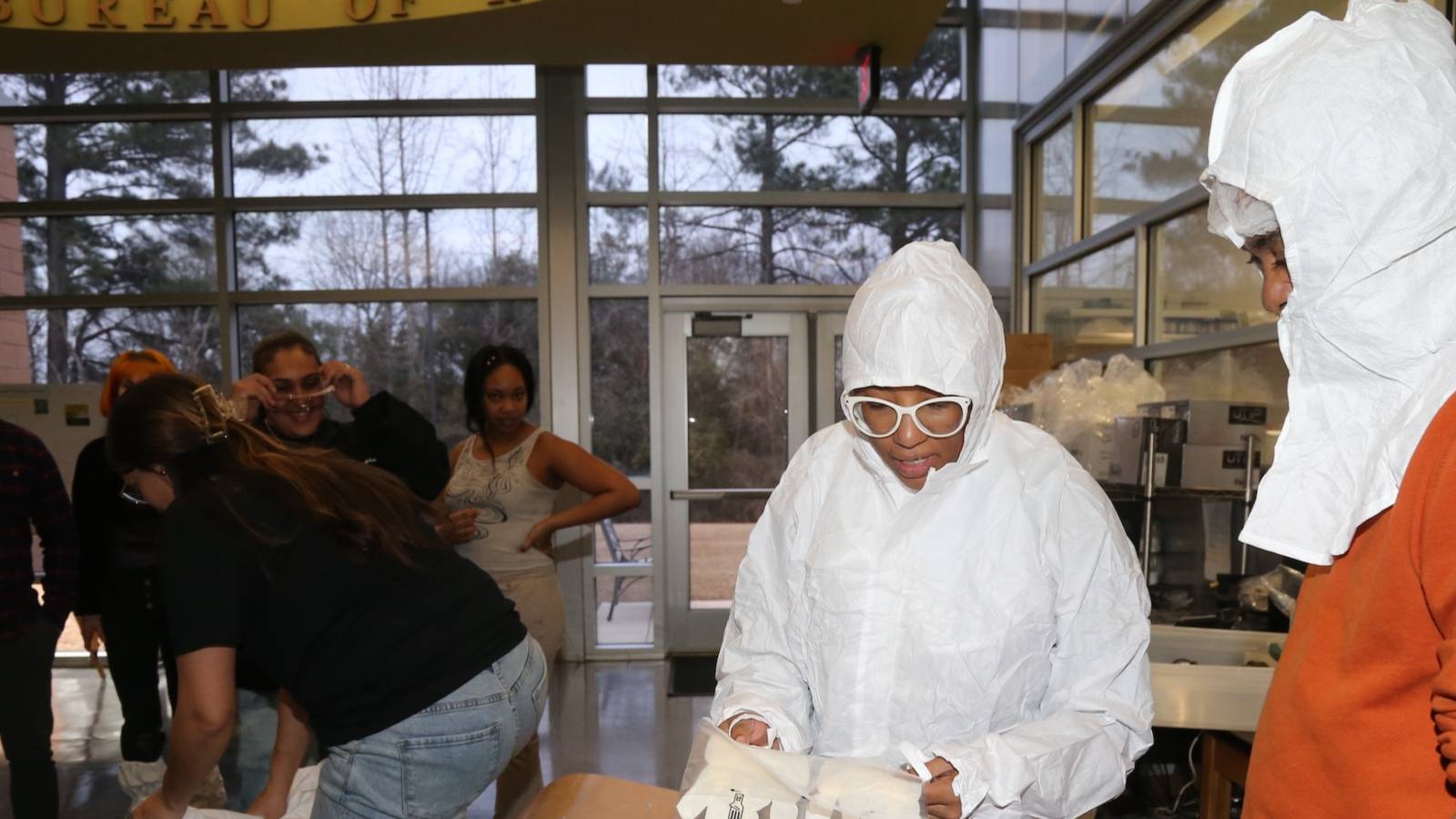 Student in lab gear at the center