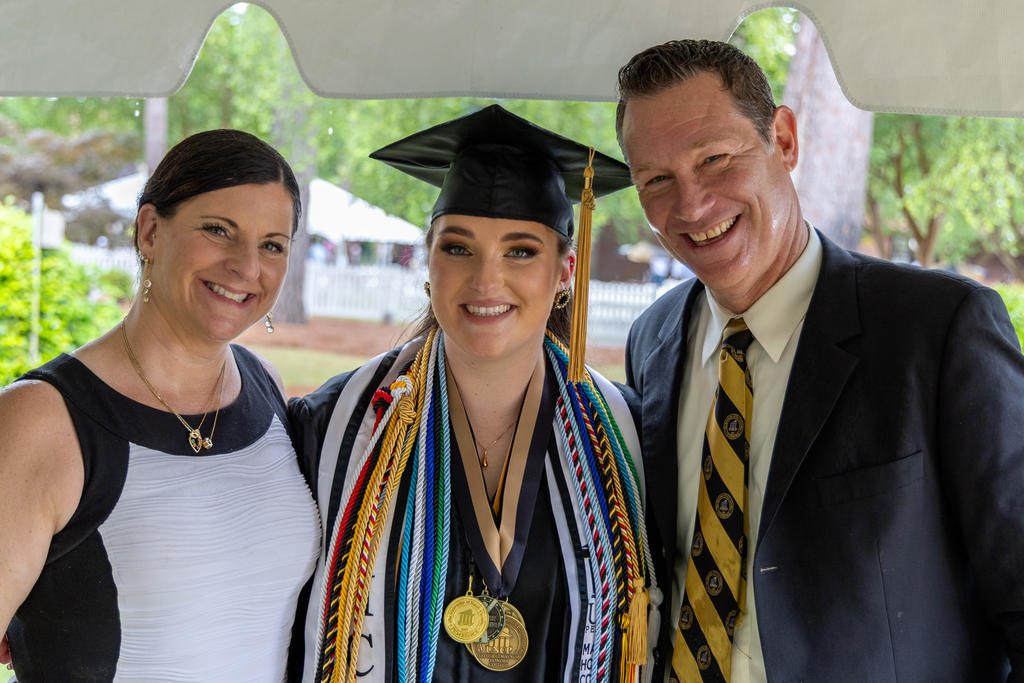 Aspen Andersson (center) with her parents Carla and Lars Andersson at the UNCP Spring Commencement.