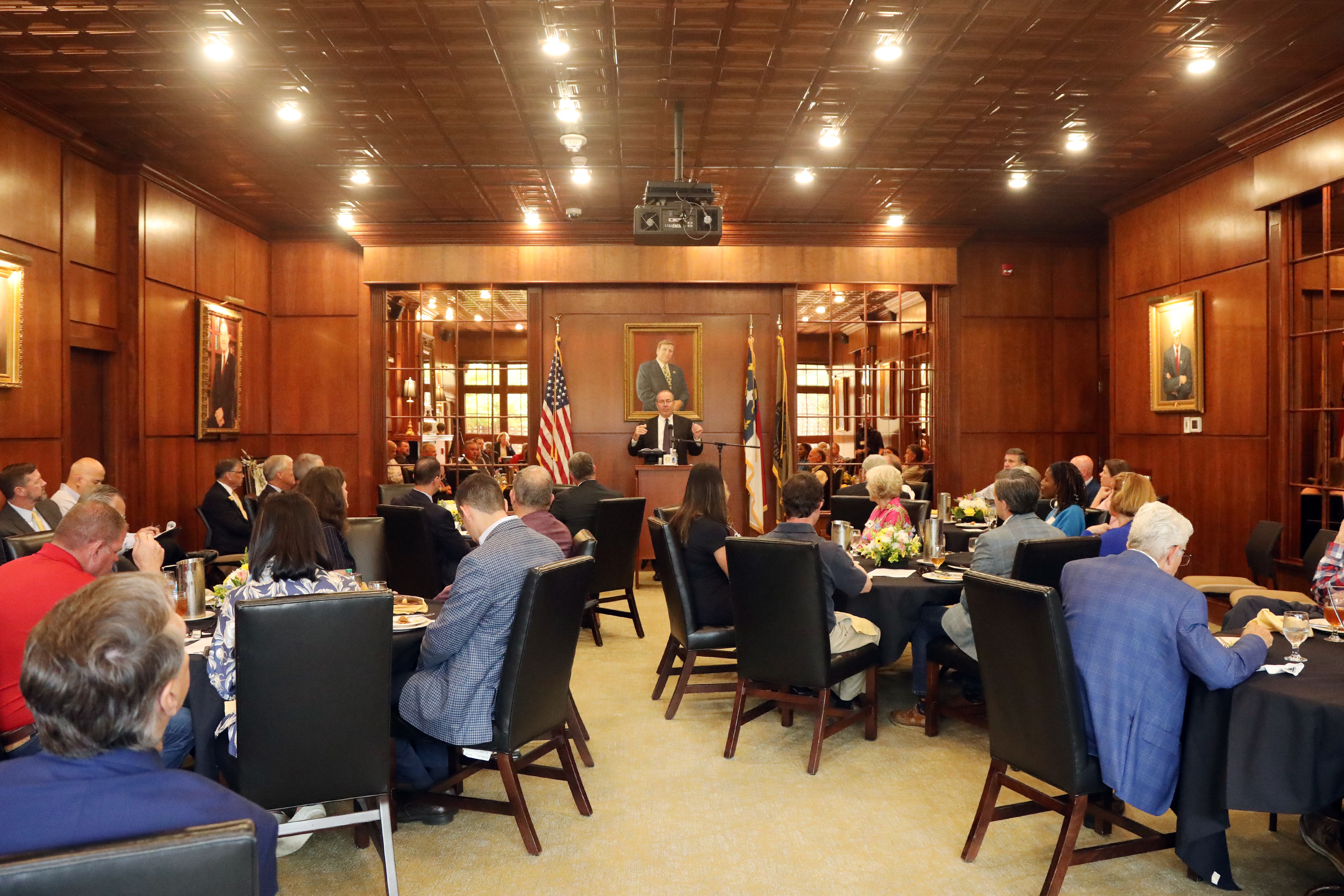 Federal Reserve Bank of Richmond President Tom Barkin speaks to a room full of community members.