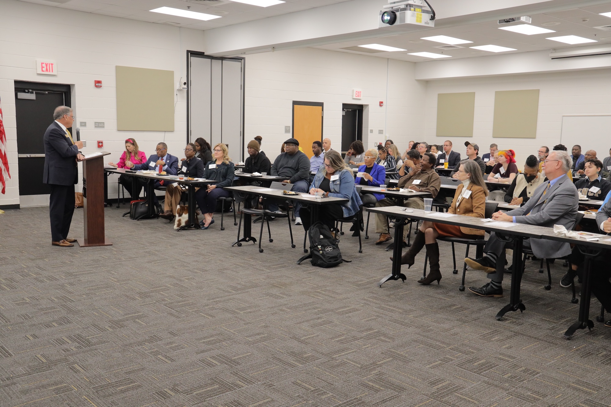 Chancellor talking to the group of people at an event