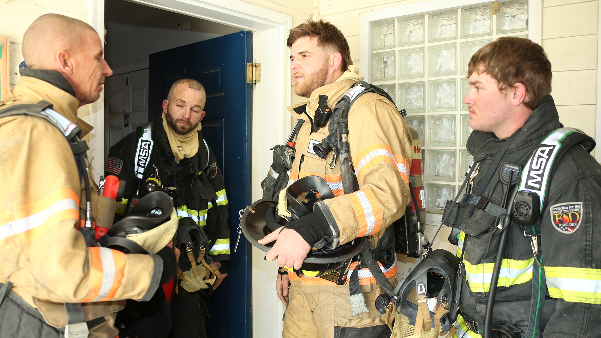 Firefighters get briefed during controlled burn