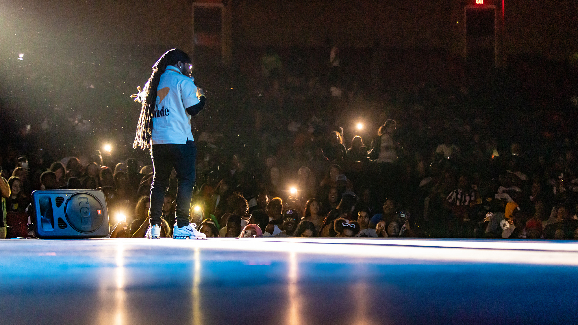 performer on the stage of the Givens Performing Arts Center