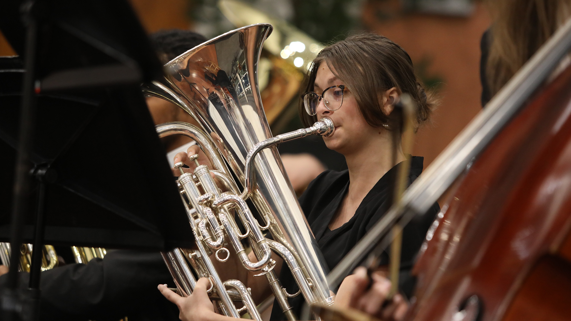 female student playing the tuba