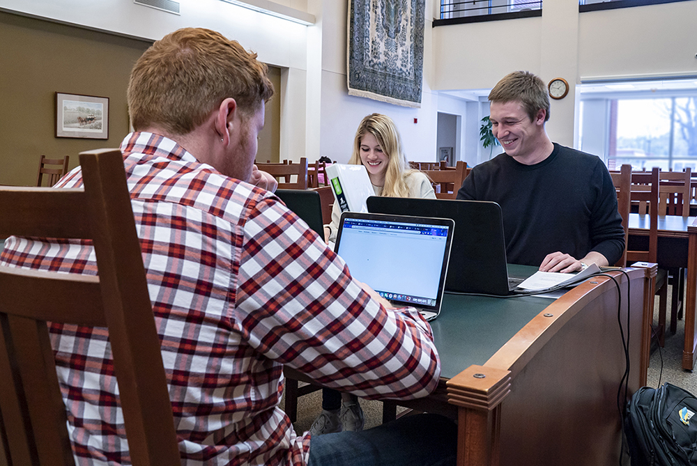 Group of students studying in the library