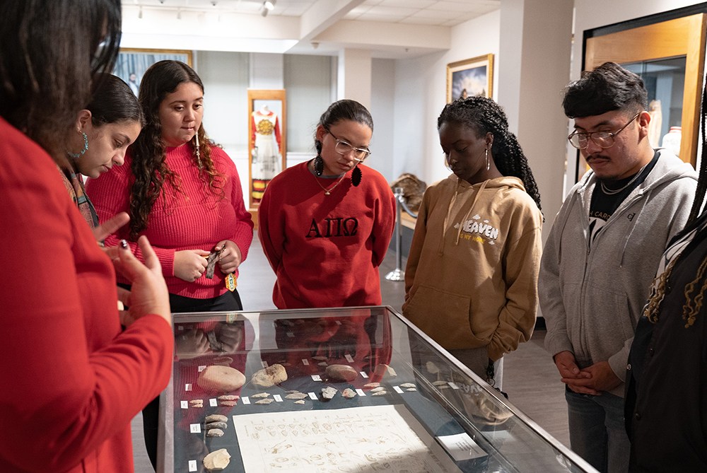 A group views arrow heads on display
