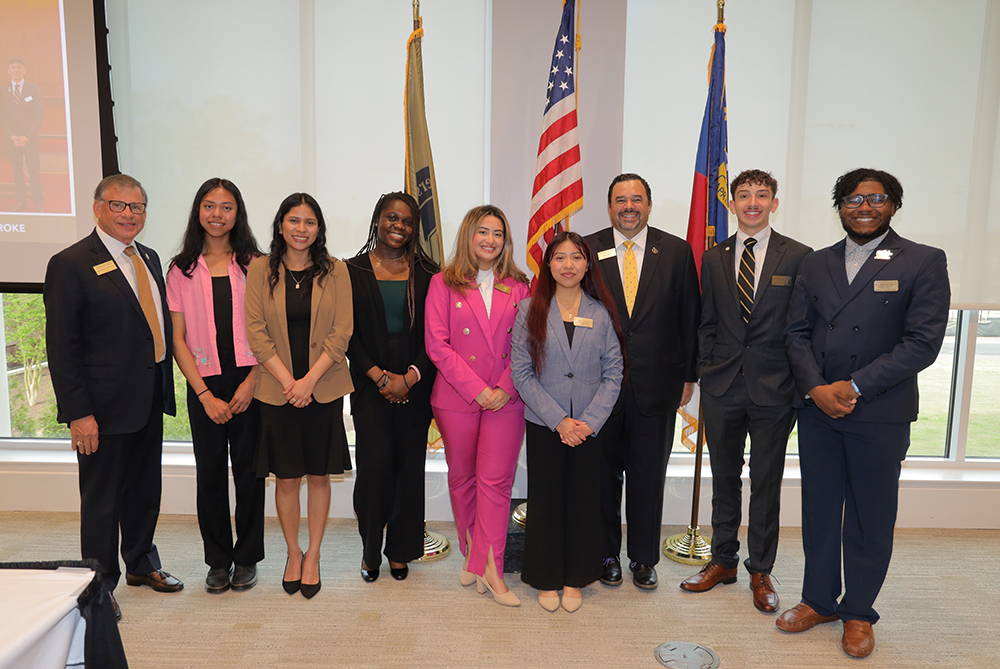 Group photo of the Board of Trustees that includes the SGA president at UNC Pembroke.