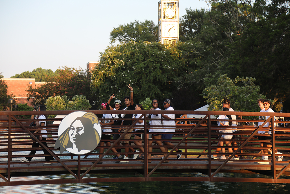 Freshman crossing the bridge during Brave Walk