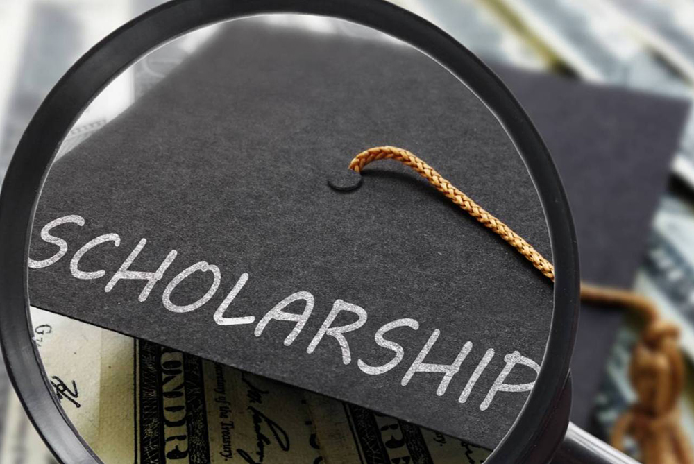 money with scholarship written out