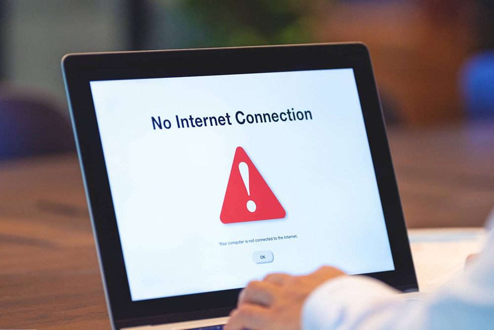 hands on a computer with internet connection problems