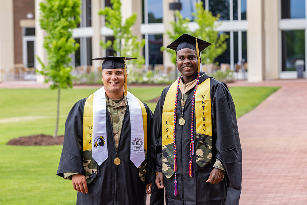 two male military students at UNC Pembroke in regalia