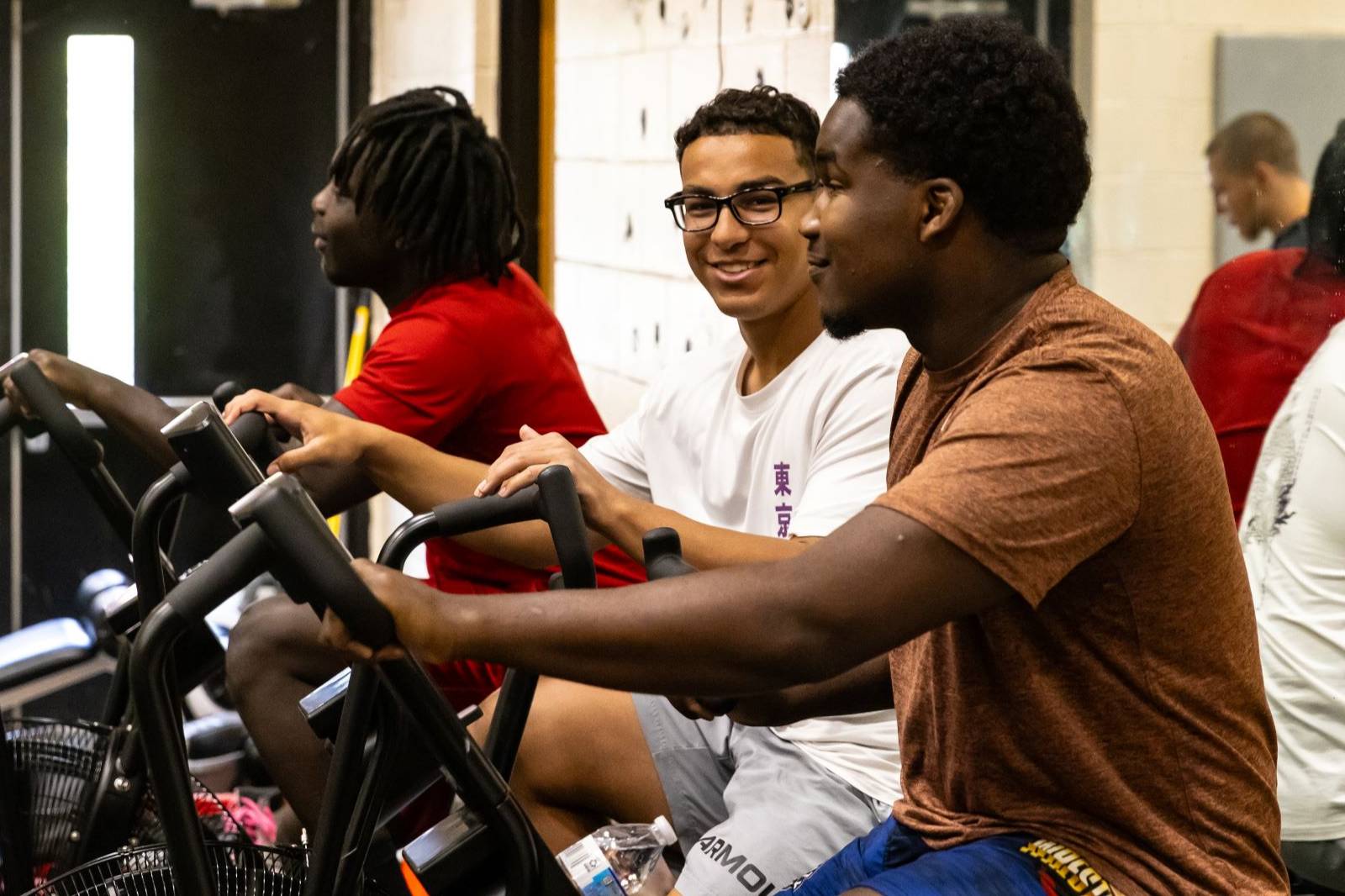 UNCP students on cycle bikes looking at the camera
