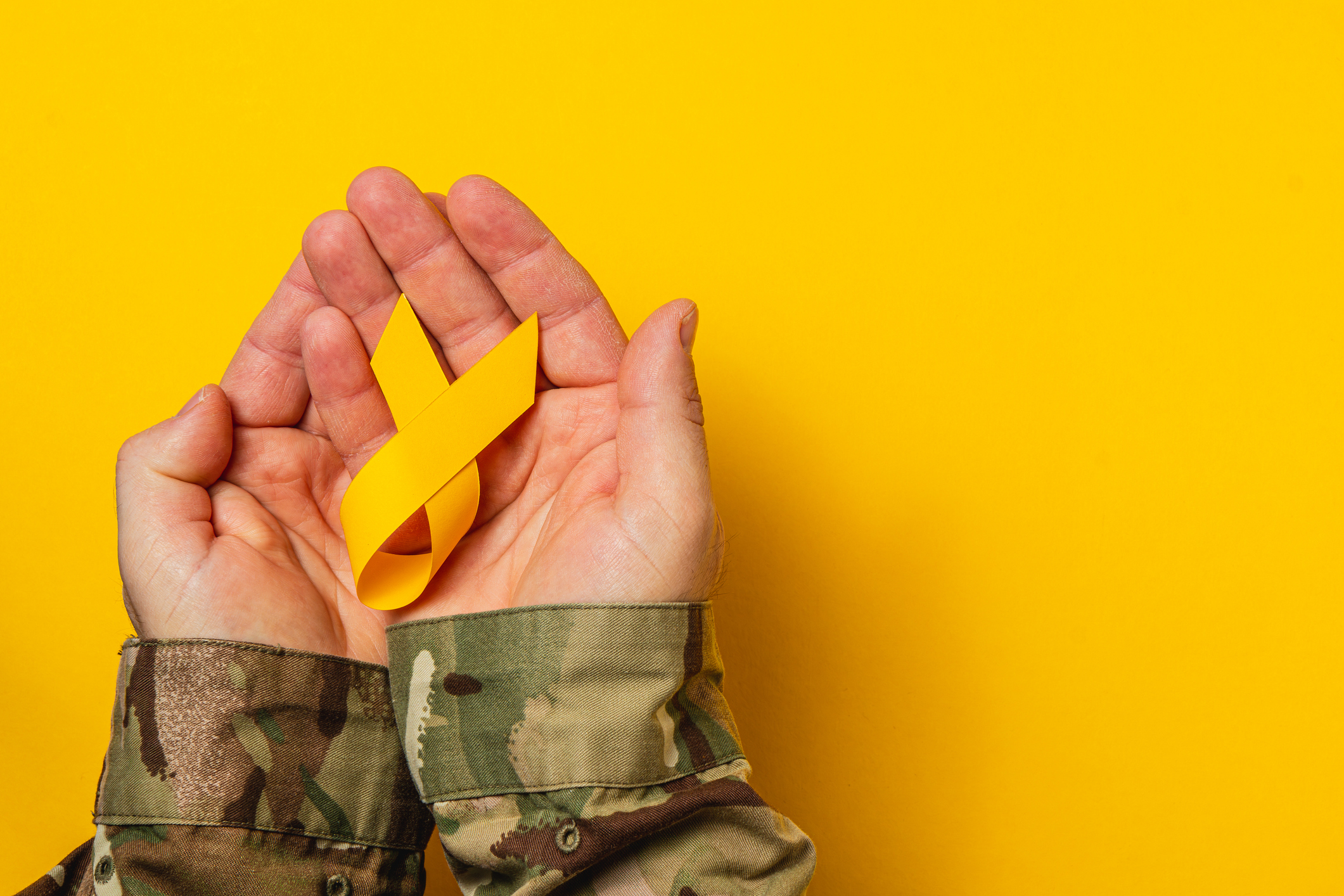 Miiltary uniform and yellow ribbon