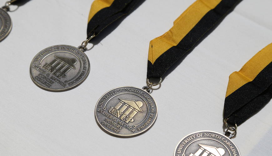 Picture of the medallion that is given to Maynor Honors College graduates