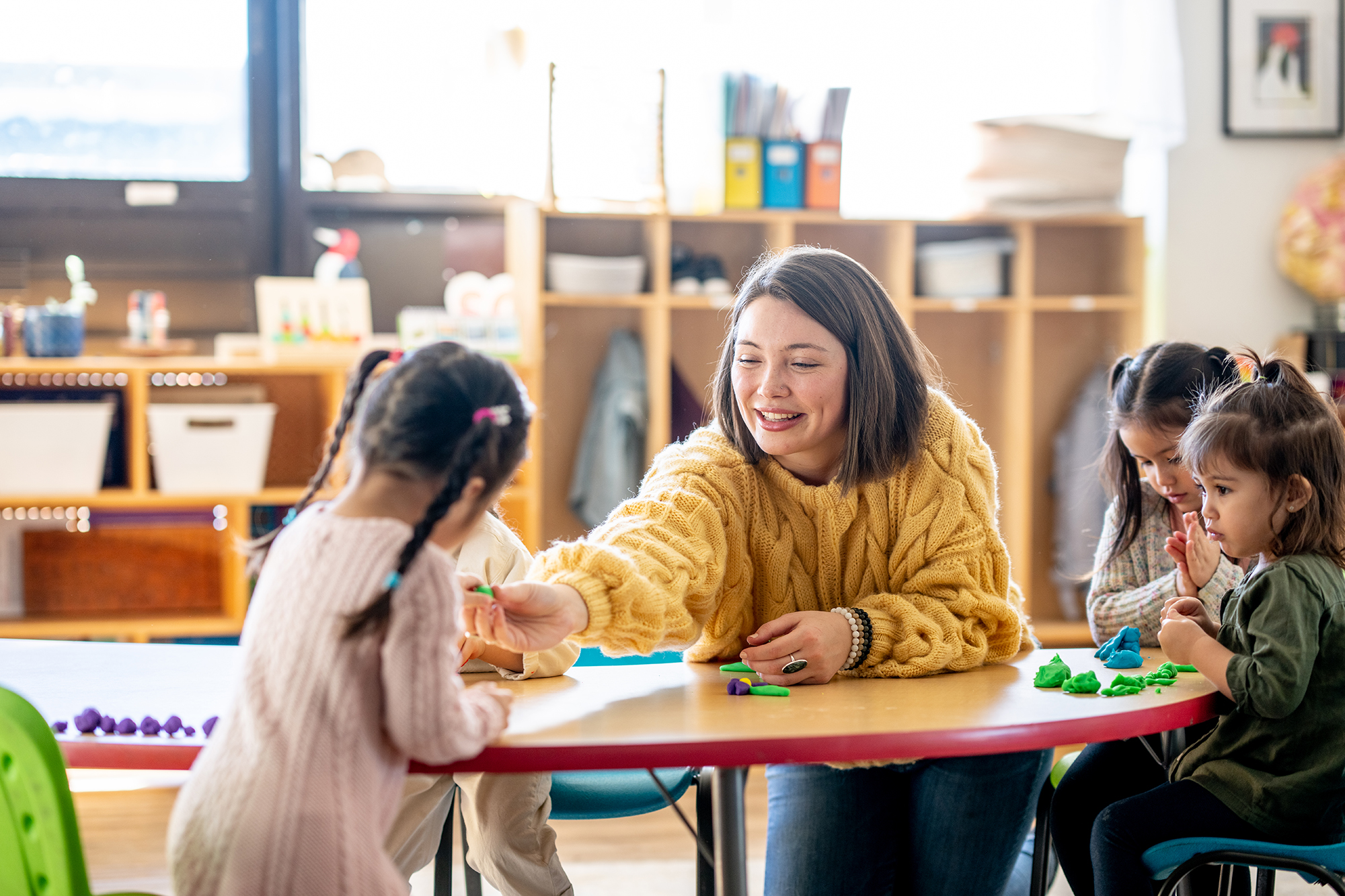 preschool teacher with children