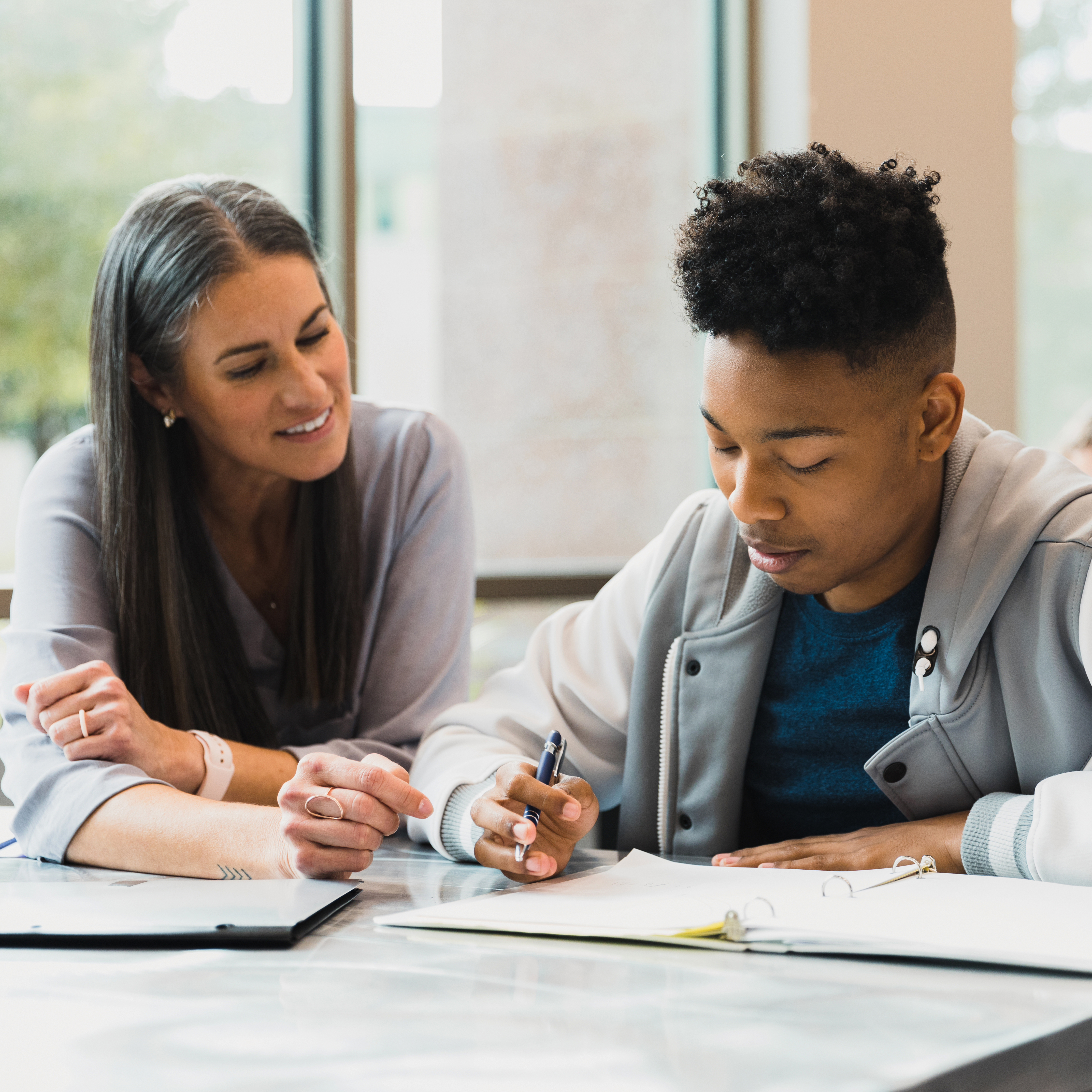 female math teacher with male student