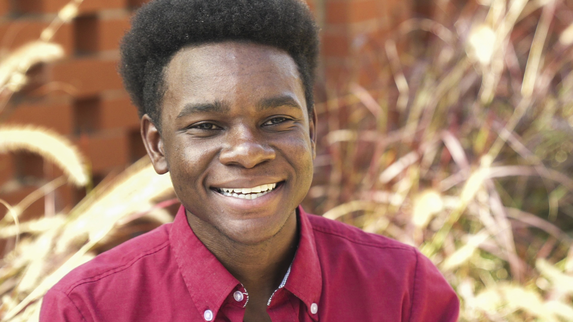 Black male MSW student headshot.