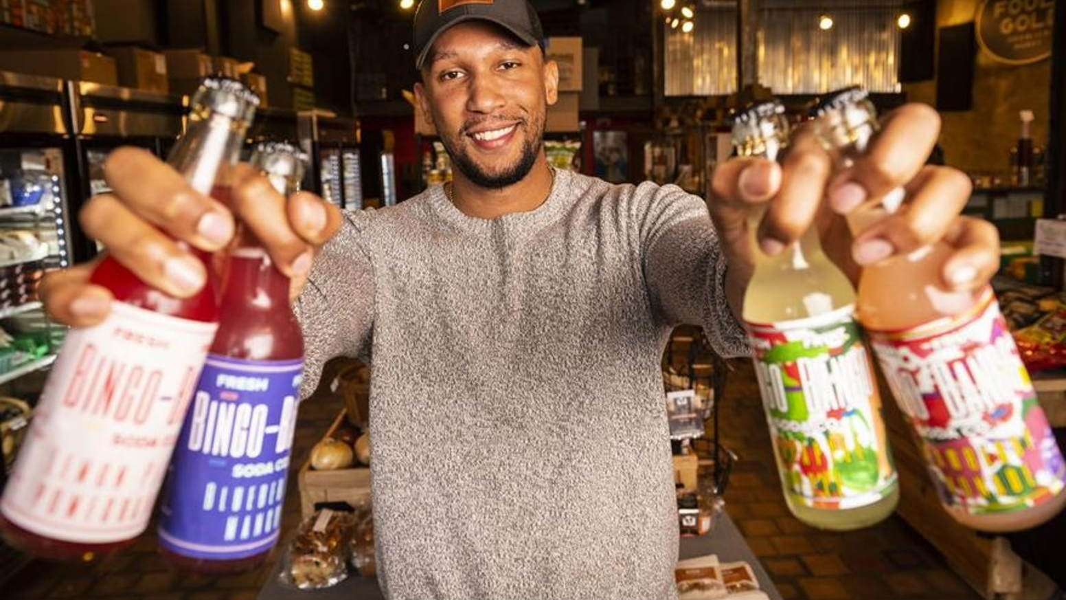 Michael Robinson holding his product