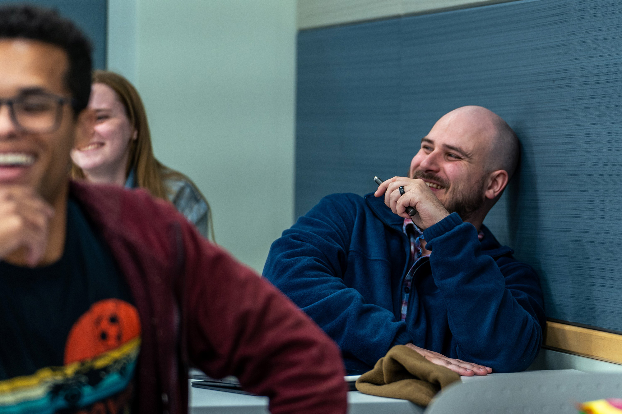 Social Work student at UNC Pembroke laughing in class with other students.