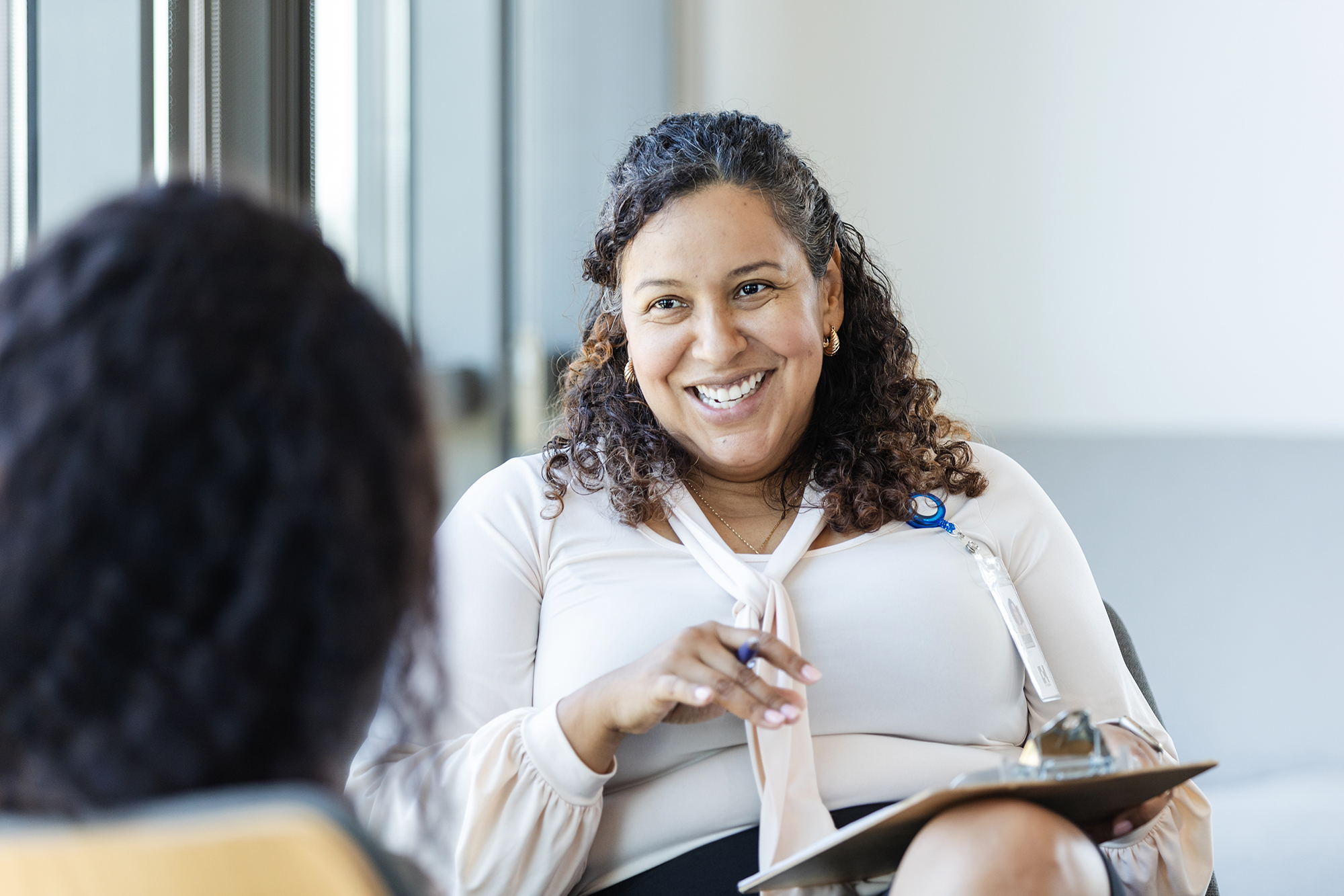 female social worker talking with a client