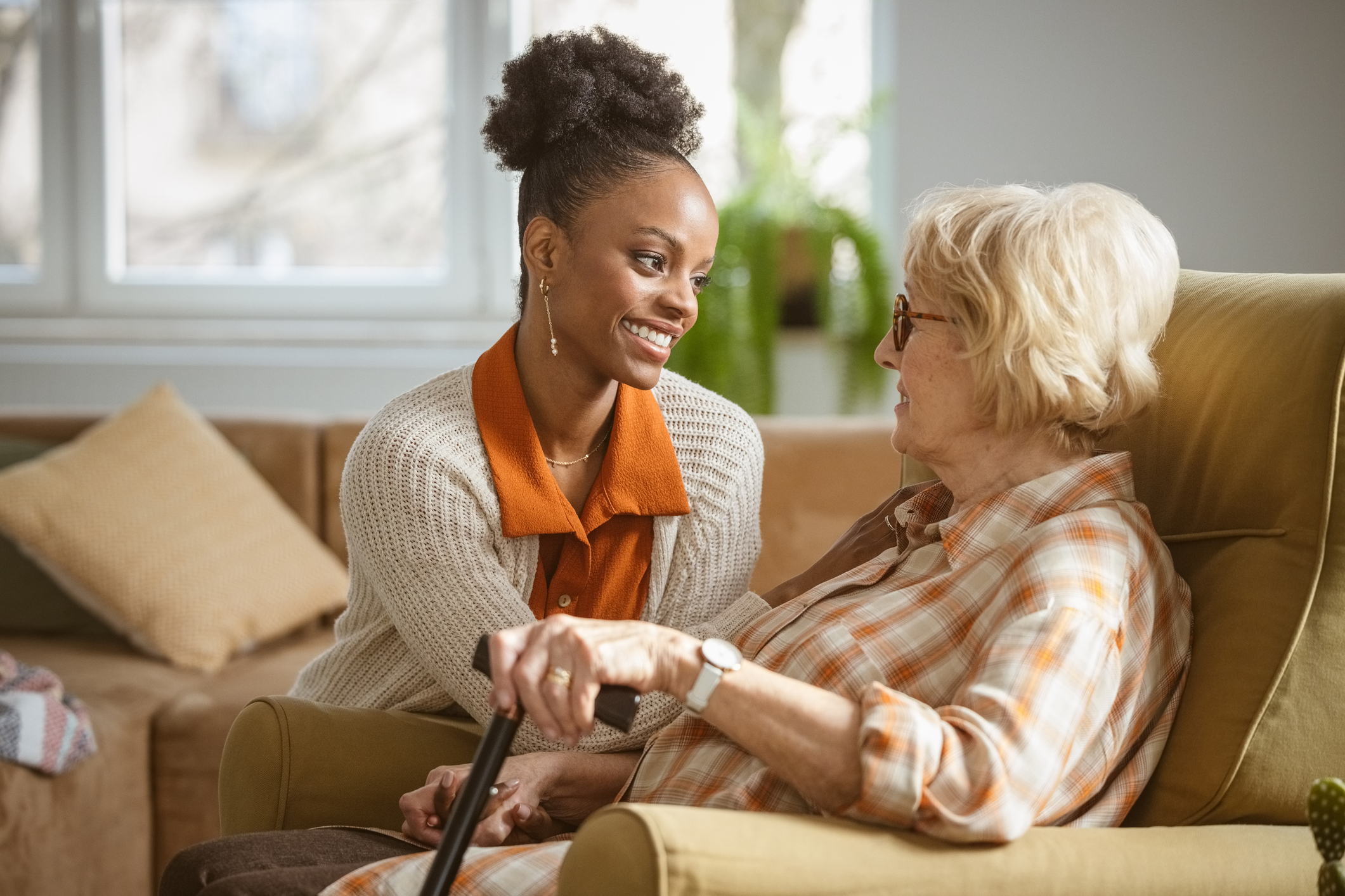 Person helping an older woman