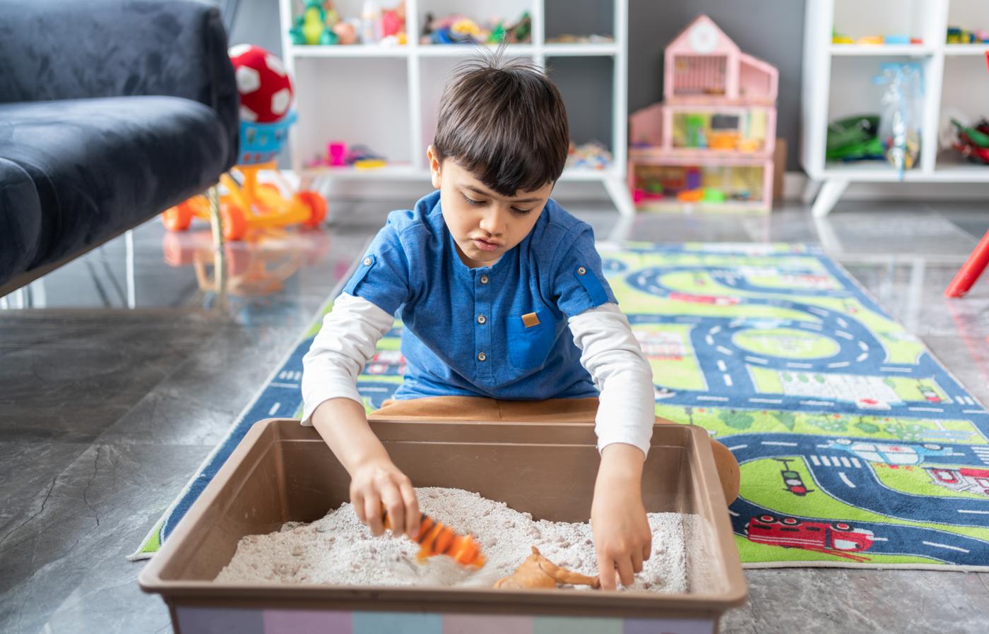 child playing with sand