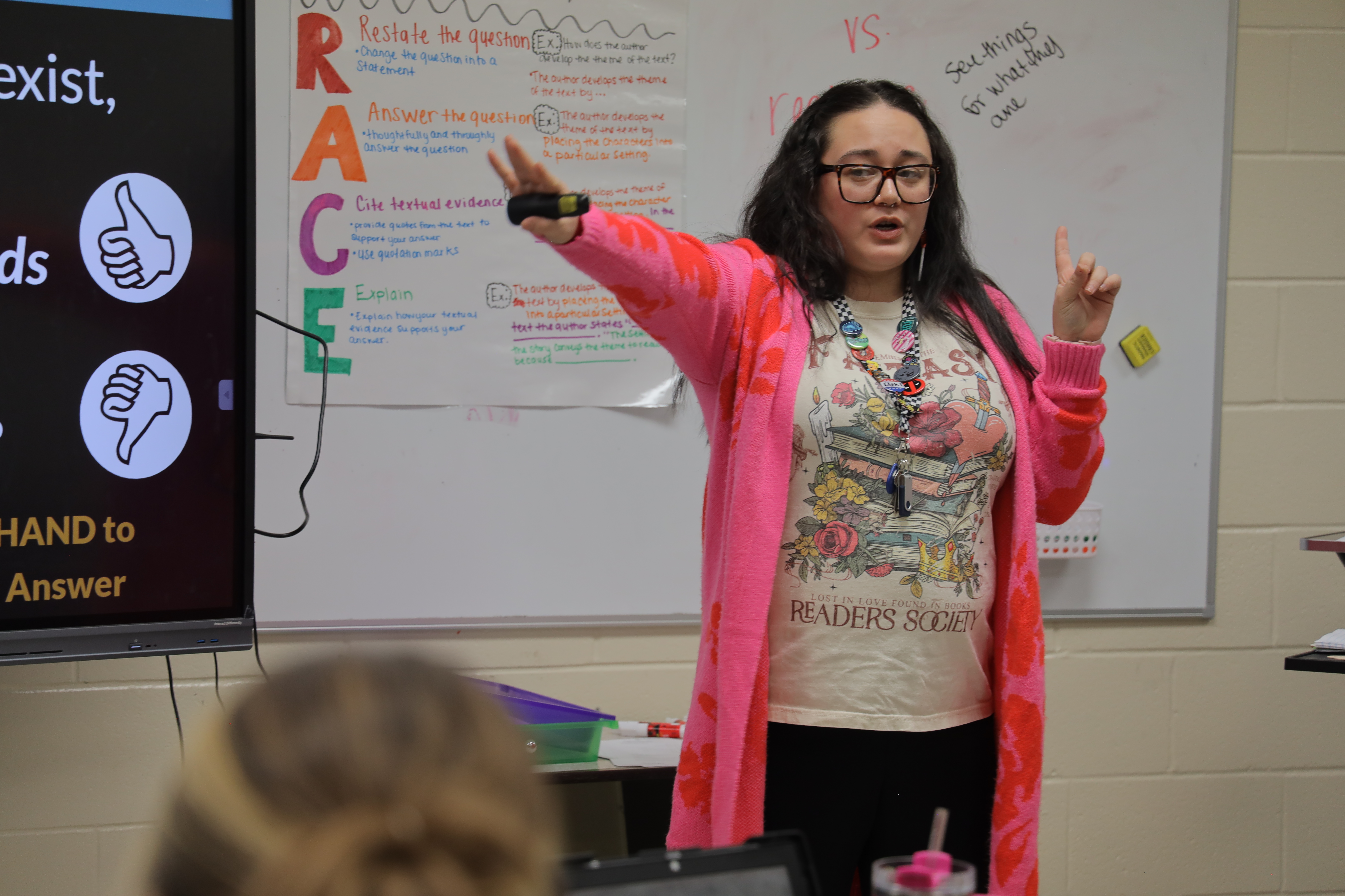 Female teacher leading a classroom
