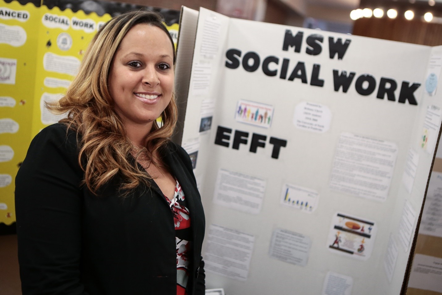 Student with MSW poster at UNCP