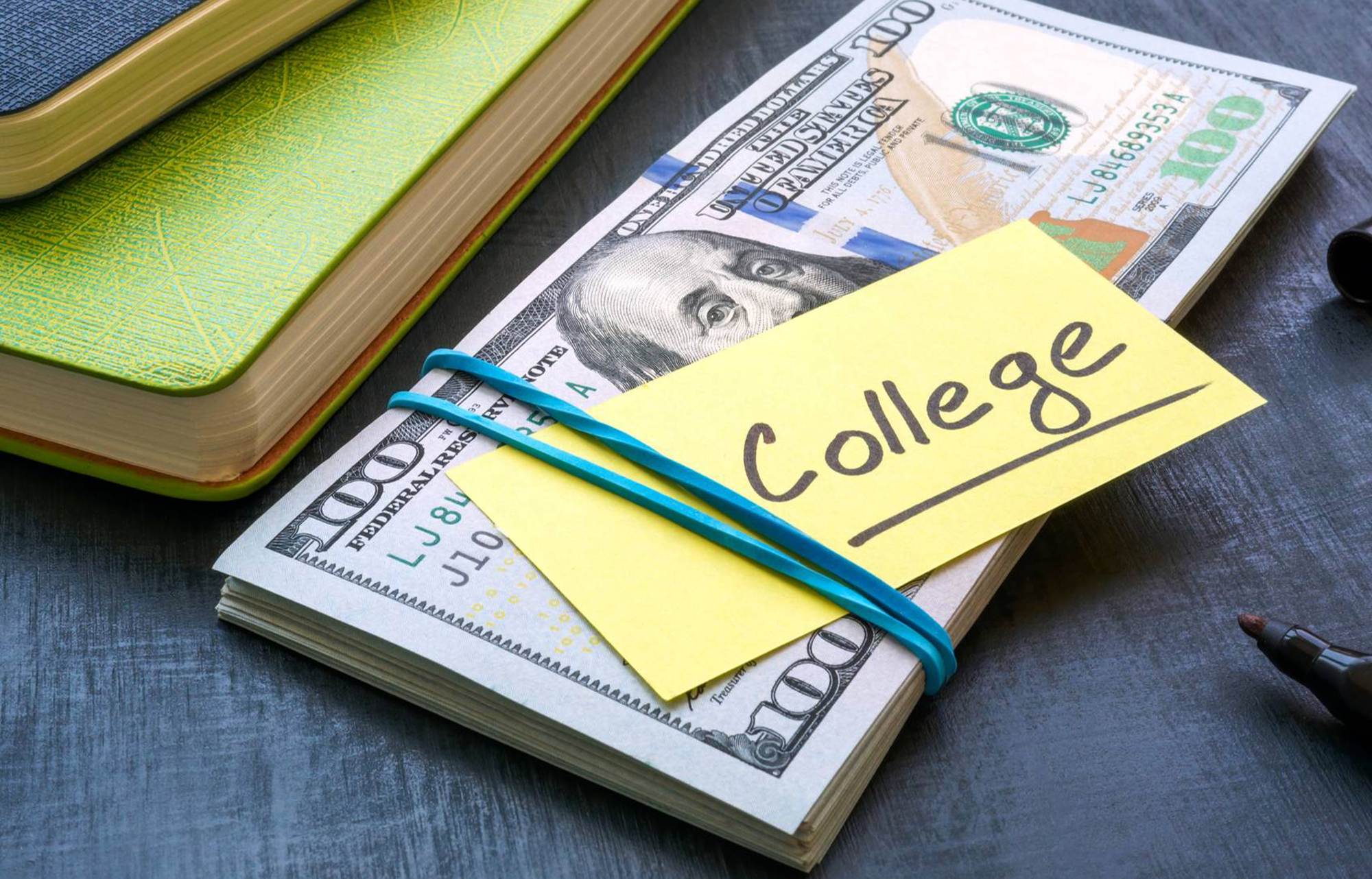 money and paper that says college