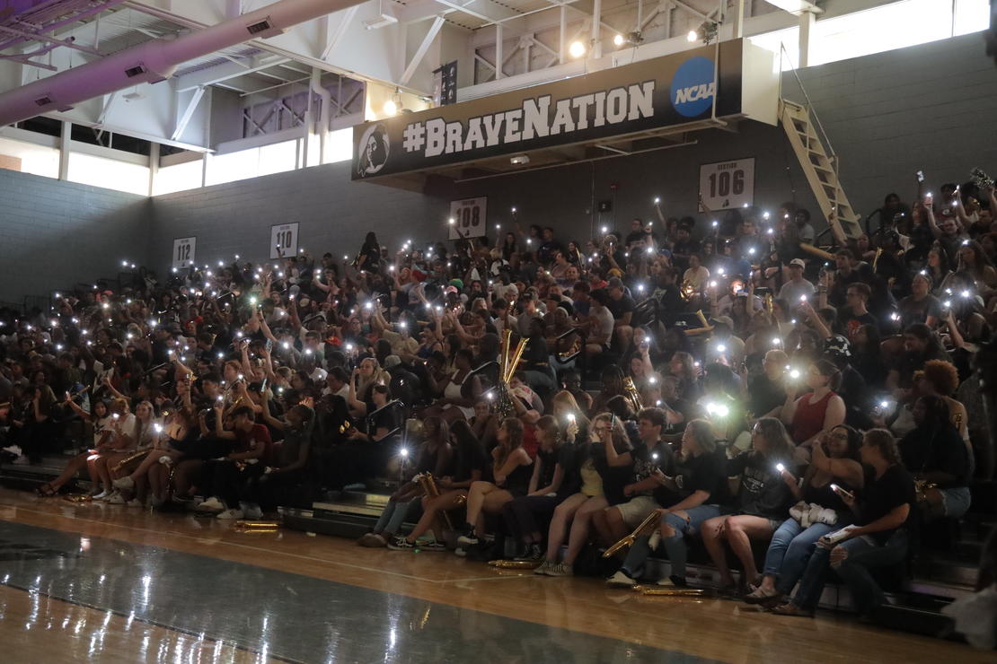 A picture of students holding up their cell phones at the Black and Gold Kickoff Pep Rally of 2023