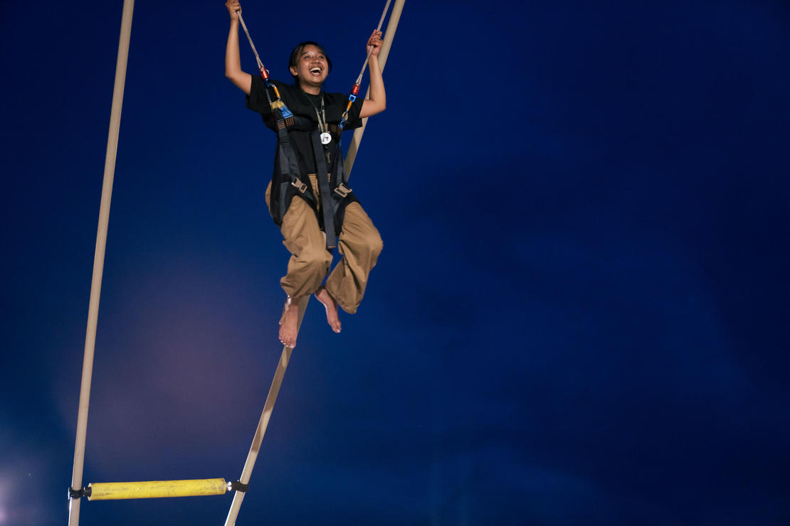 A picture of a student on a bungee attraction at Flight 2023