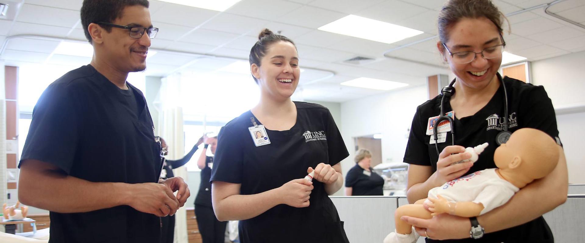 UNCP nursing students work in the simulation lab.