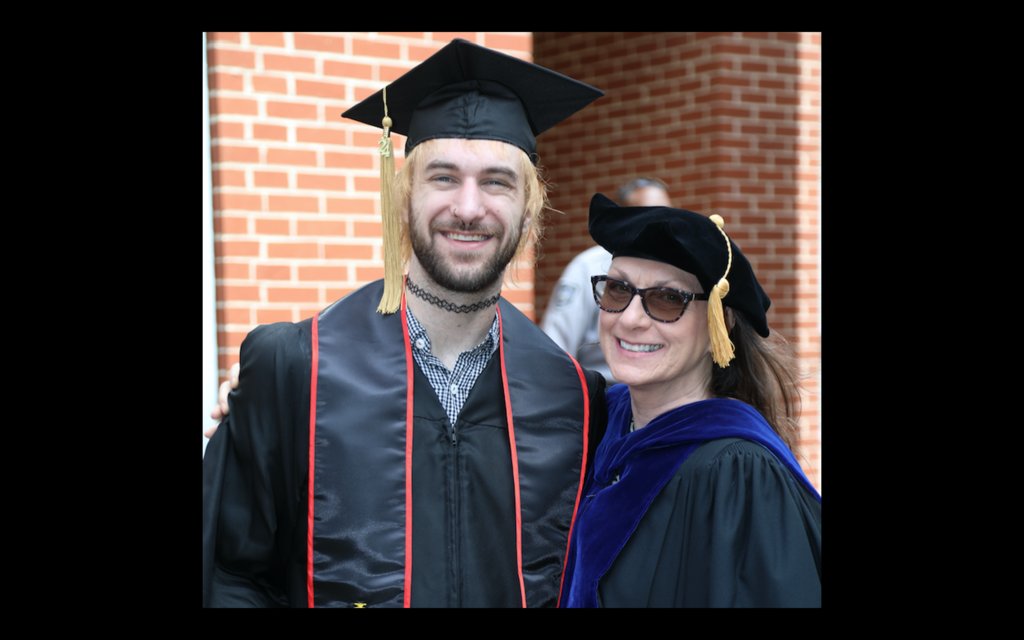 Dr. Cynthia Miecznikowski poses for a graduation picture with her son, Brenden.