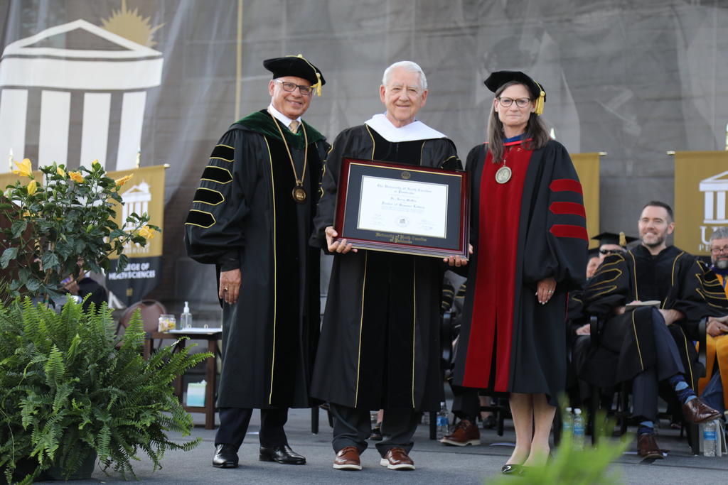 Chancellor Robin Gary Cummings, left, Dr. Jerry McGee and Provost Diane Prusank