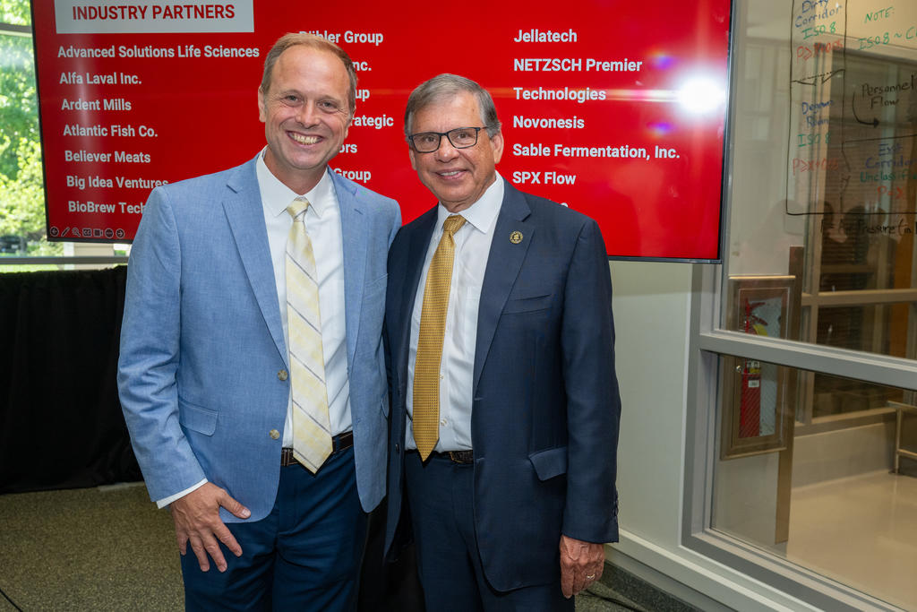 Dr. Bryan Sales, left, with Chancellor Robin Gary Cummings at the event marking the opening of the Bezos Center for Sustainable Protein at NC State University