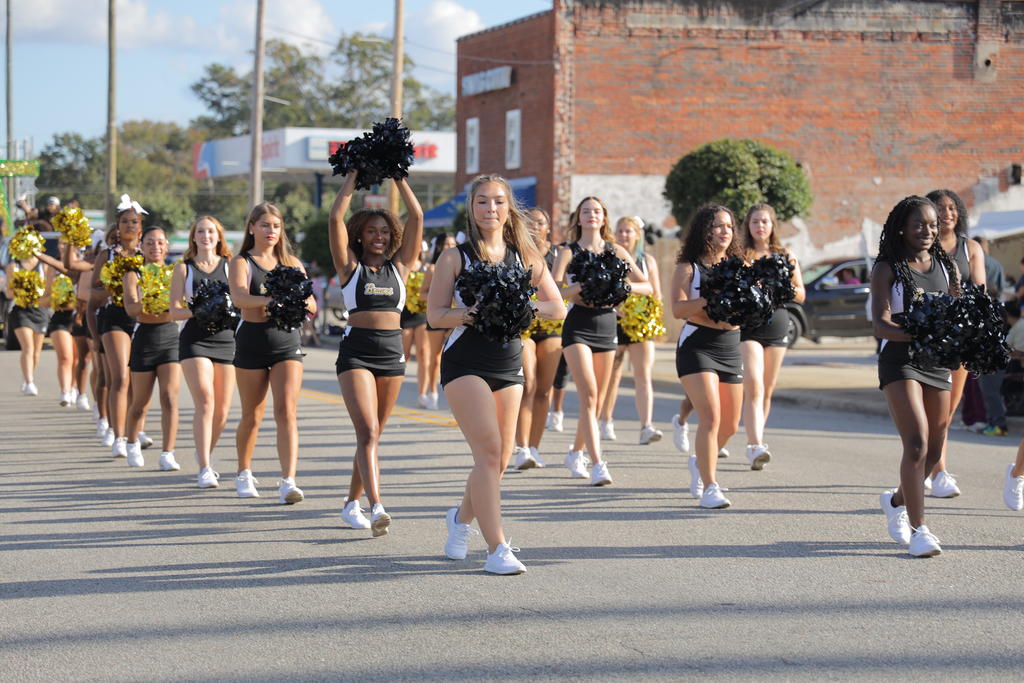 UNCP Cheerleaders walking downtown Pembroke during the Parade